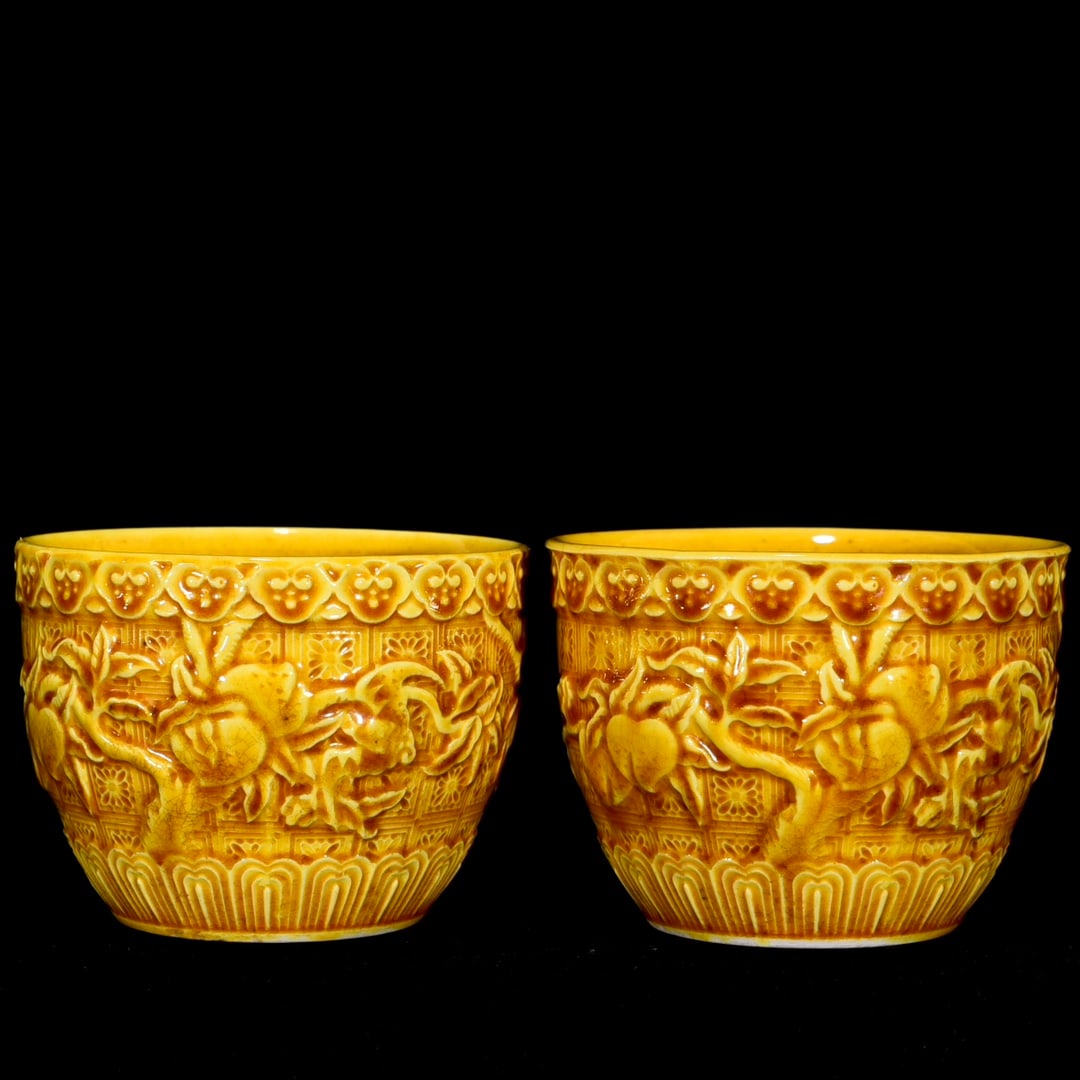 Ming Hongzhi Yellow Glazed Peach Pattern Cup: A yellow-glazed cup with carved peach design from the Hongzhi period of the Ming Dynasty, 6 cm high and 7.5 cm in diameter. Provenance:Private collection, Cliffside Park, New Jersey. Our dedicated tea