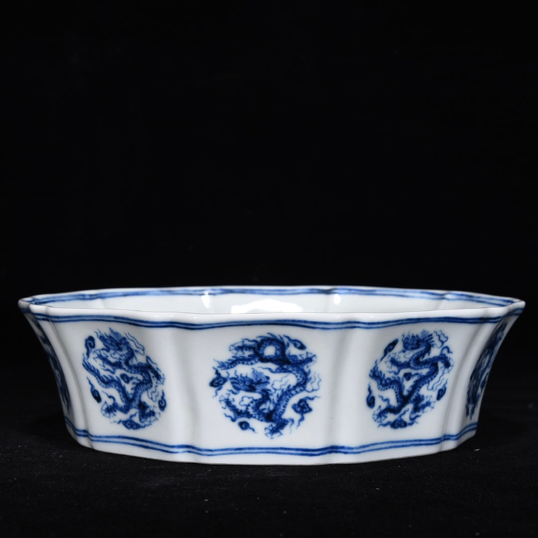 Ming Dynasty Blue and White Dragon Pattern Ten-Sided Washer: Ming Dynasty blue and white porcelain ten-sided washer with dragon design, 5 cm high, 19 cm maximum diameter. Provenance:Mr. Stefan, Minneapolis, Minnesota. Our dedicated team expertly handles both do