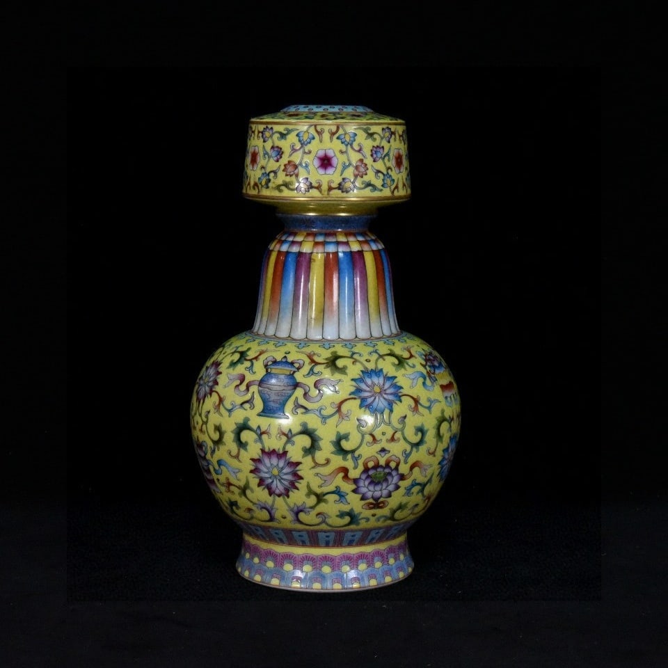 A pair of Qing Dynasty Qianlong period yellow-glazed enamel-painted and gilded floral candlesticks (1 of 9)