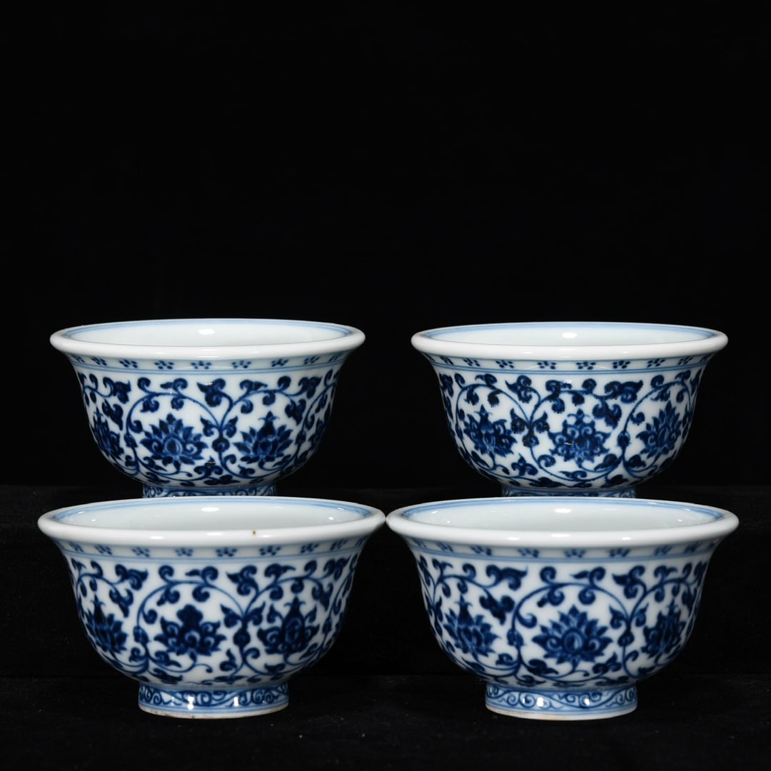 Ming Yongle blue and white porcelain cup with fish scroll design: A Ming Dynasty Yongle period blue and white porcelain cup with a fish scroll design, 5 cm high and 9 cm in diameter. Provenance:Private collection, Houston, Texas. Our dedicated team expertly handles