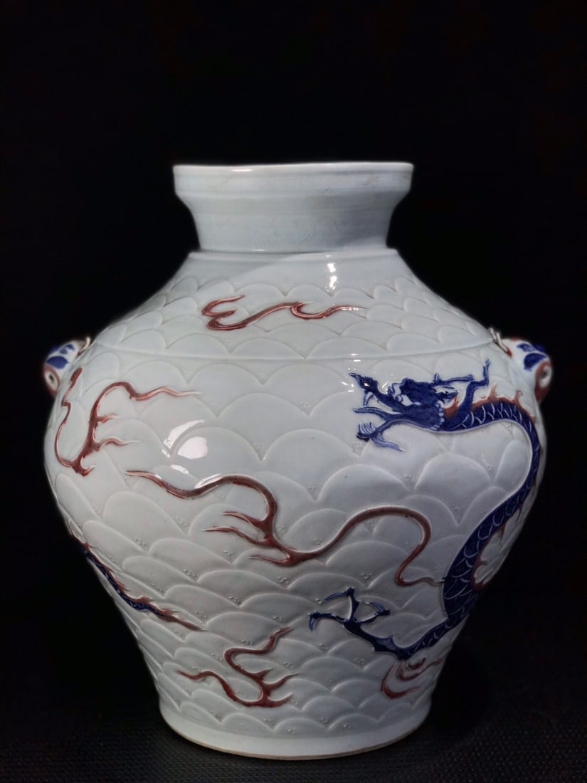 Celadon glazed jar with relief dragon and tiger head design and hanging handles: A celadon-glazed jar with a relief of dragon and tiger heads, handmade, with a beautiful shape, upright form, and in excellent condition. Provenance:Private collection from a professor in Harvard Univ