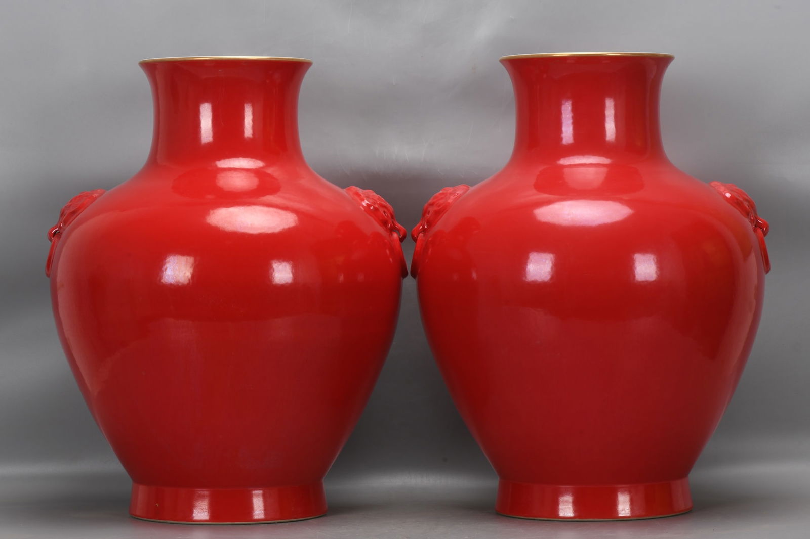 A pair of Qing Dynasty, Yongzheng period, chili-red animal-head vases (1 of 9)