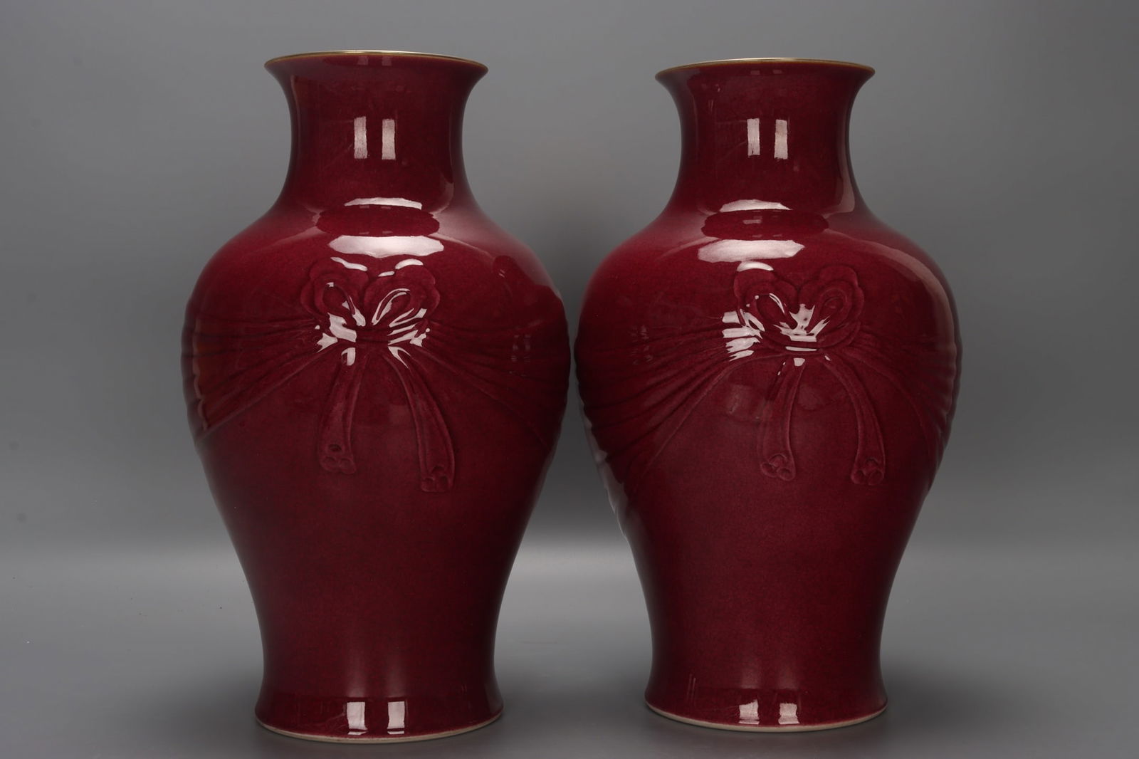 A pair of Qing Dynasty, Yongzheng period gemstone rouge-red carved bow vases (1 of 9)