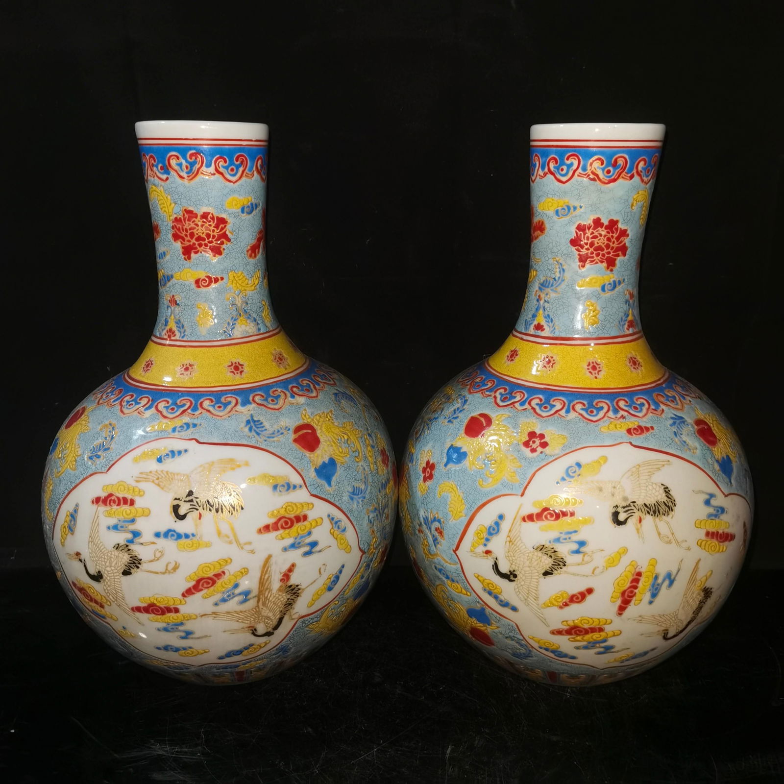 A pair of Qing Dynasty famille rose crane-patterned celestial globe vases (1 of 7)