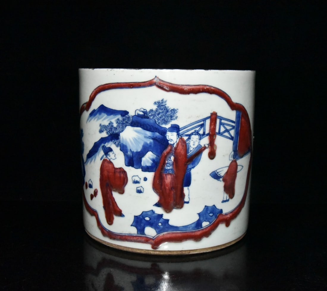 Kangxi period blue and white underglaze red figure and story brush pot: A Qing Dynasty Kangxi period blue and white underglaze red brush pot depicting figures and scenes, 17 x 18.5 cm Provenance:Private Estate, Michigan. Our dedicated team expertly handles both domestic a