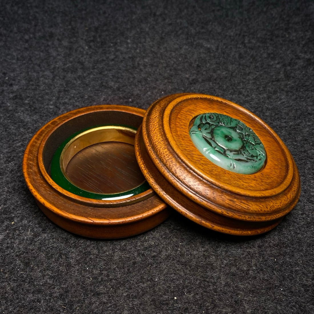 Rosewood jewelry box inlaid with jade and precious stones, containing a copper-rimmed jade bracelet.: Rosewood jewelry box inlaid with jade and precious stones, containing a copper-rimmed jade bracelet. Provenance:Private collection from a professor in Harvard University. Our dedicated team expertly h