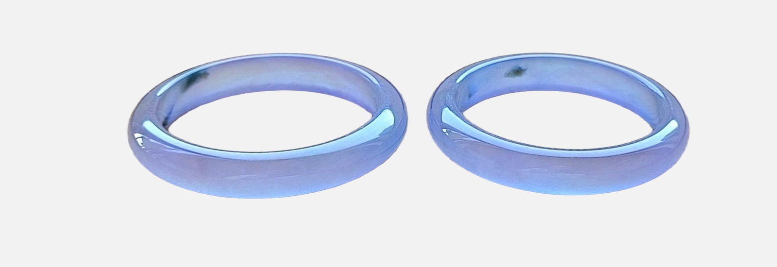 A pair of top-grade dragon stone type flat strip violet jadeite bracelets: A pair of top-grade dragon stone type flat strip violet jadeite bangles, with excellent translucency and absolutely perfect. Provenance:Private collection from a professor in Massachusetts Institute o