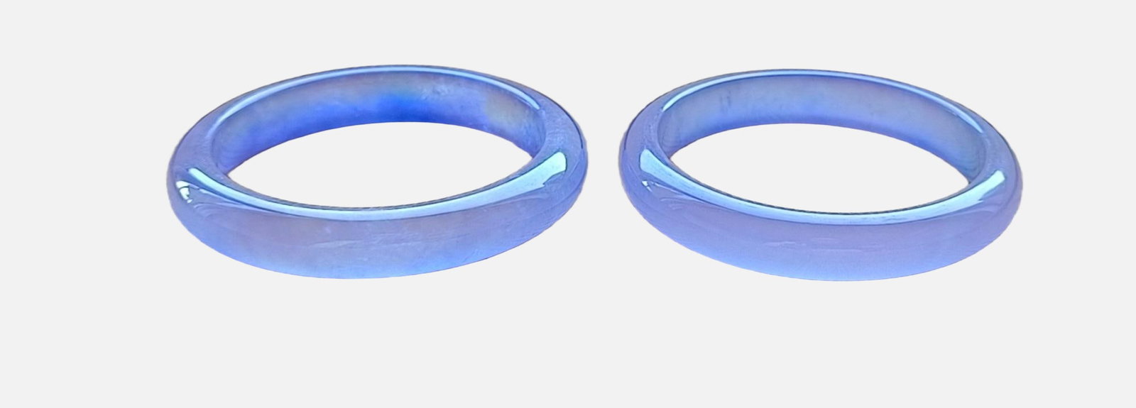 A pair of top-grade dragon stone type flat strip violet jadeite bracelets: A pair of top-grade dragon stone type flat strip violet jadeite bangles, with excellent translucency and absolutely perfect. Provenance:Private collection from a professor in Massachusetts Institute o