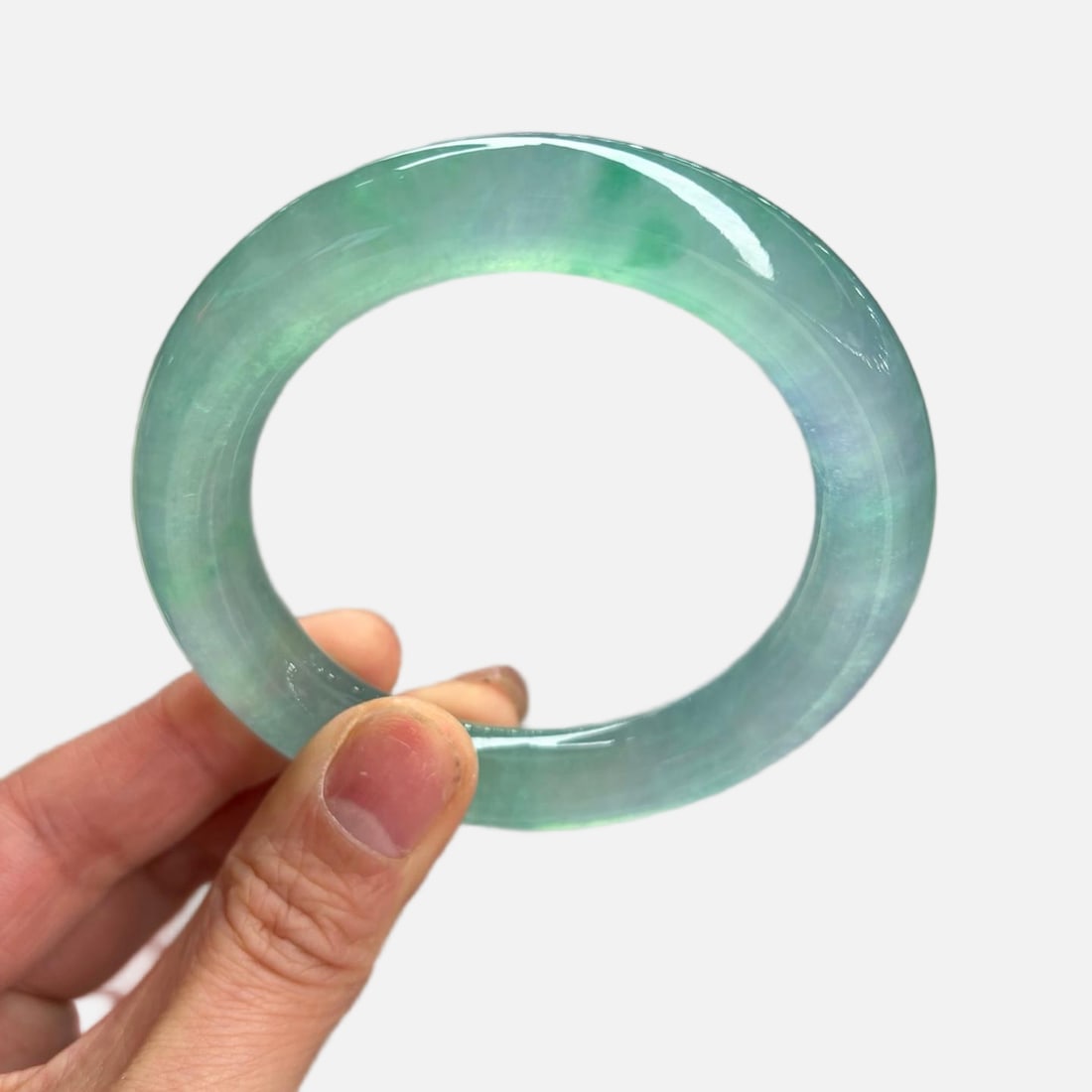 Blue water round rod jade bracelet: Blue-green jadeite bangle with round bars, has fine, inconspicuous lines. Provenance:Private Estate, Honolulu, Hawaii. Our dedicated team expertly handles both domestic and global shipping arrangement