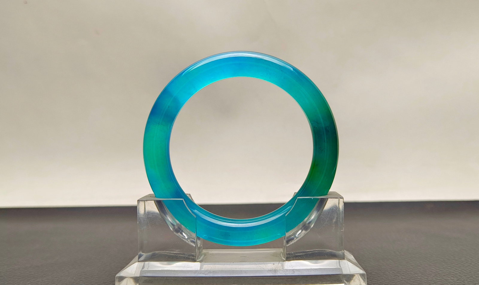 A top-grade dragon stone type sky blue jadeite bangle: top-grade dragon stone type sky blue jadeite bangle, with excellent clarity and is absolutely perfect. Provenance:Private collection of the retired lawyer Mr.Henry, Chelmsford, Massachusetts. Our dedi