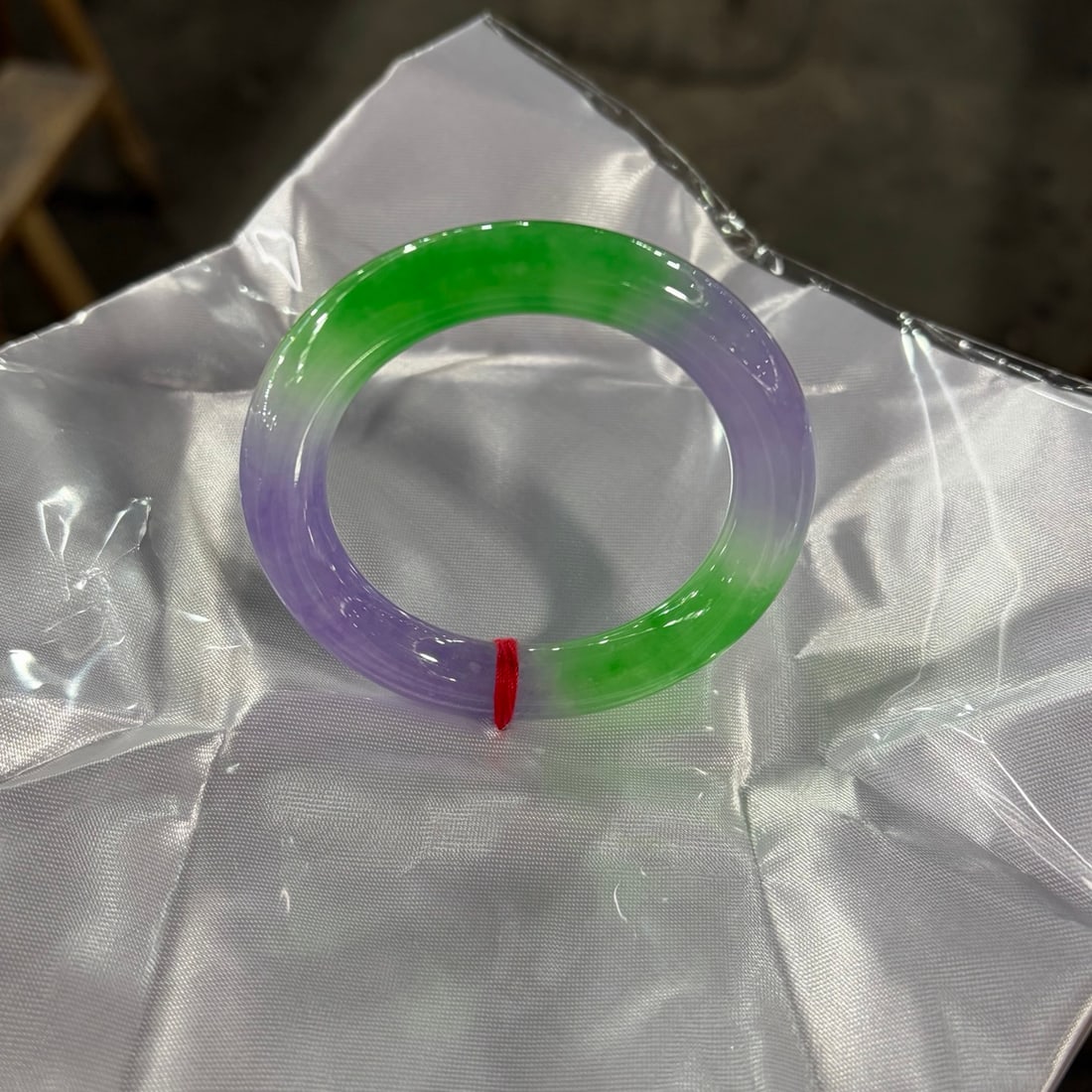 Spring-colored violet and green jadeite round bangle: Spring-colored violet and green jadeite round bangle Provenance:Mr. Stefan, Minneapolis, Minnesota. Our dedicated team expertly handles both domestic and global shipping arrangements.We also offer CON