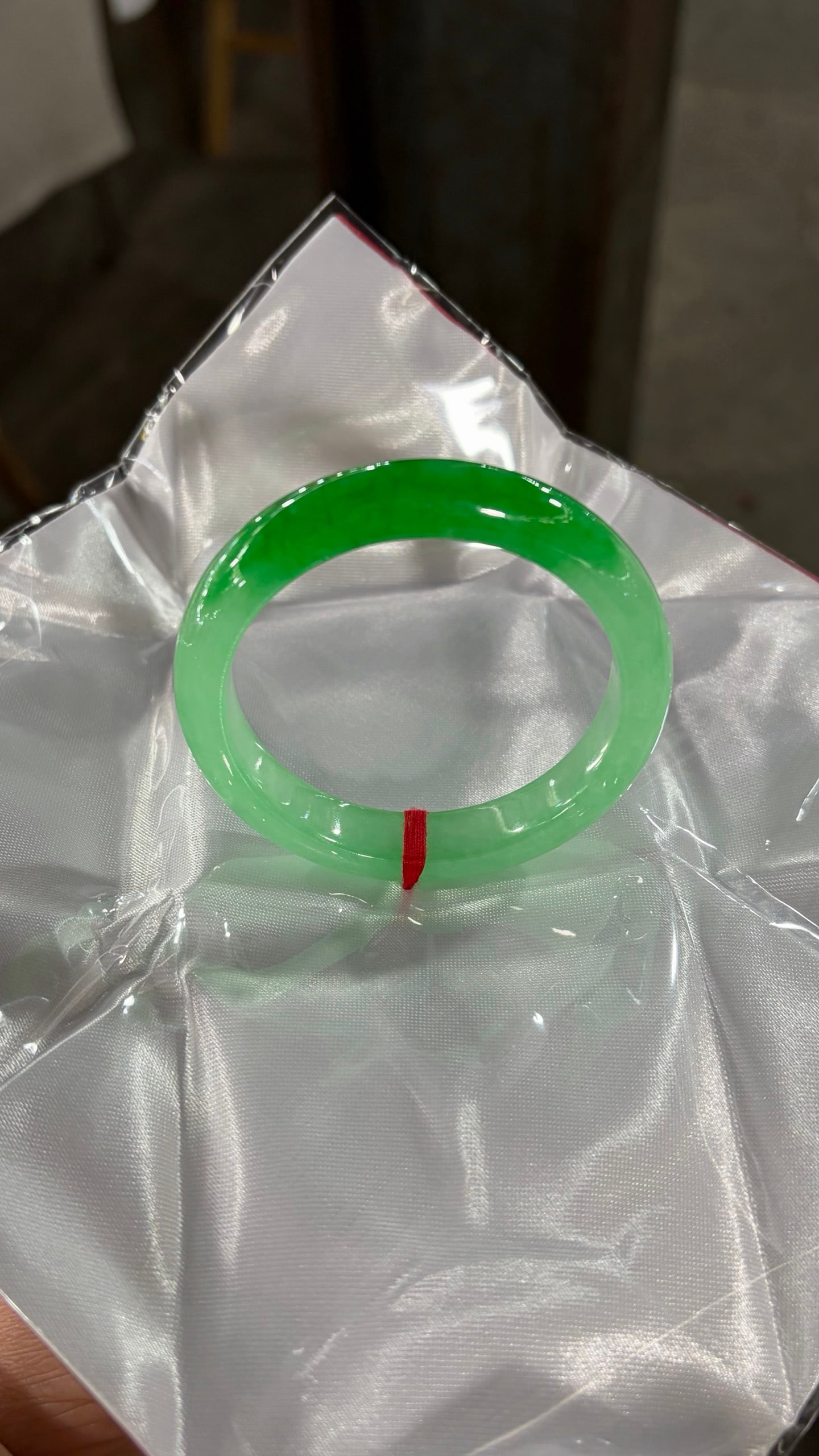 Green jadeite bangle: Green jadeite bangle Provenance:Mr. Stefan, Minneapolis, Minnesota. Our dedicated team expertly handles both domestic and global shipping arrangements.We also offer CONSOLIDATED SHIPPING for all goods