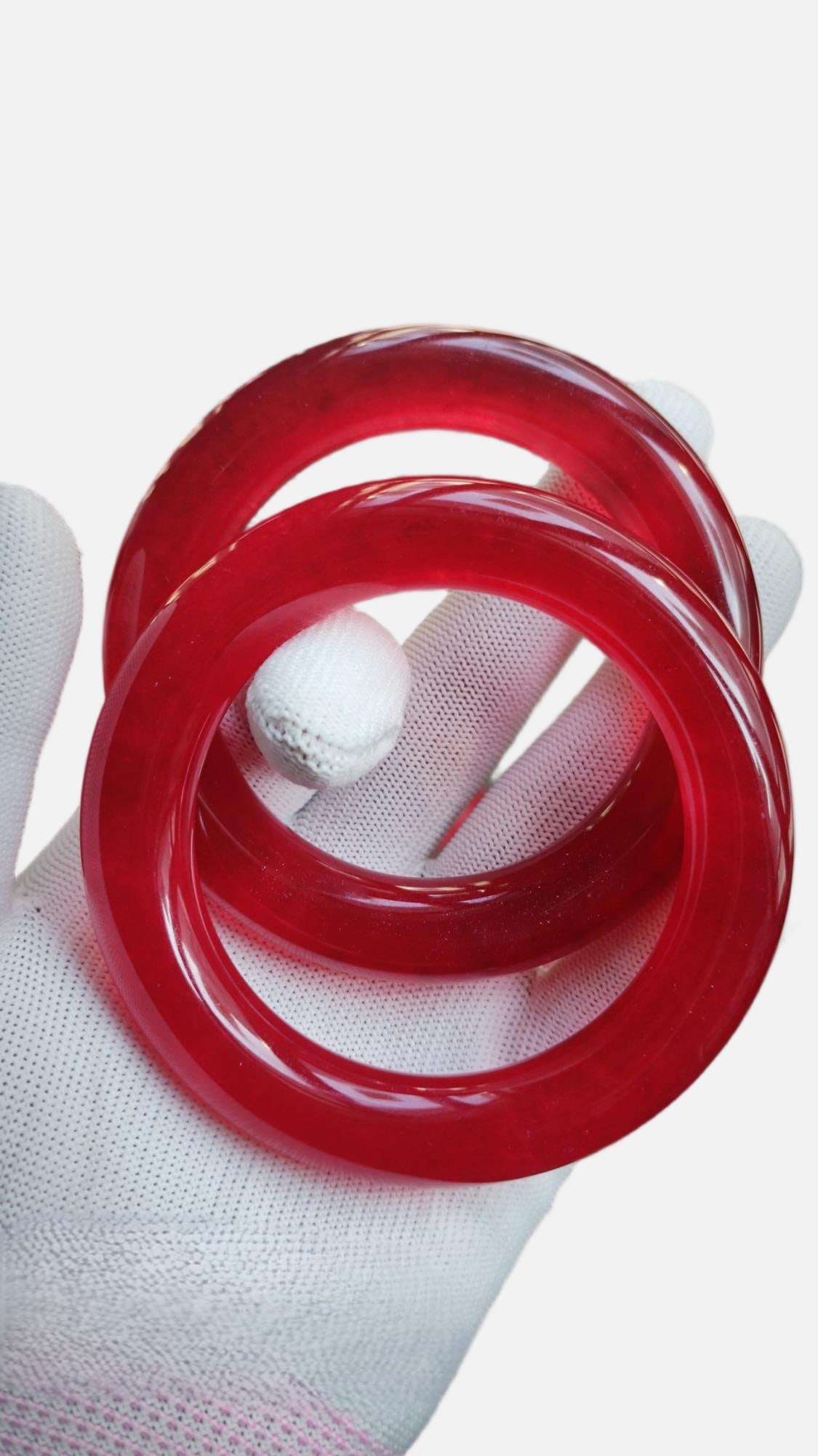 A pair of high-ice jadeite bangles and red jadeite bangles (1 of 7)