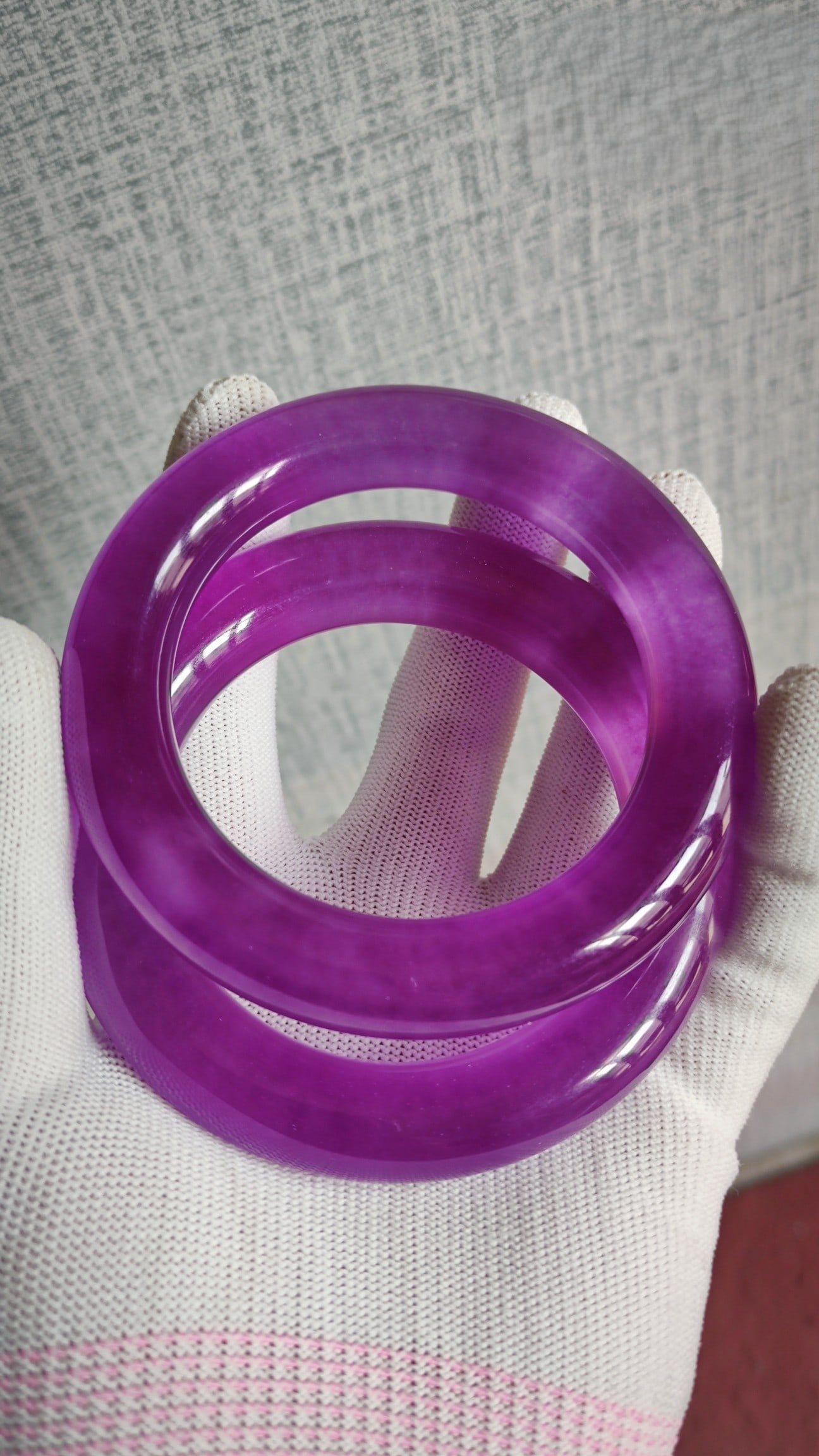 A pair of high-ice jadeite bangles, and a pair of purple jadeite bangles. (1 of 8)