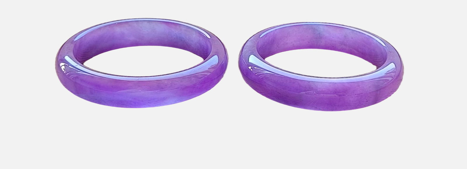 A pair of dragon-stone type violet flat jadeite bracelets: A pair of dragon-stone type violet flat jadeite bangles, with excellent translucency and absolutely perfect. Provenance:Private collection from a professor in University of Pennsylvania. Our dedicated