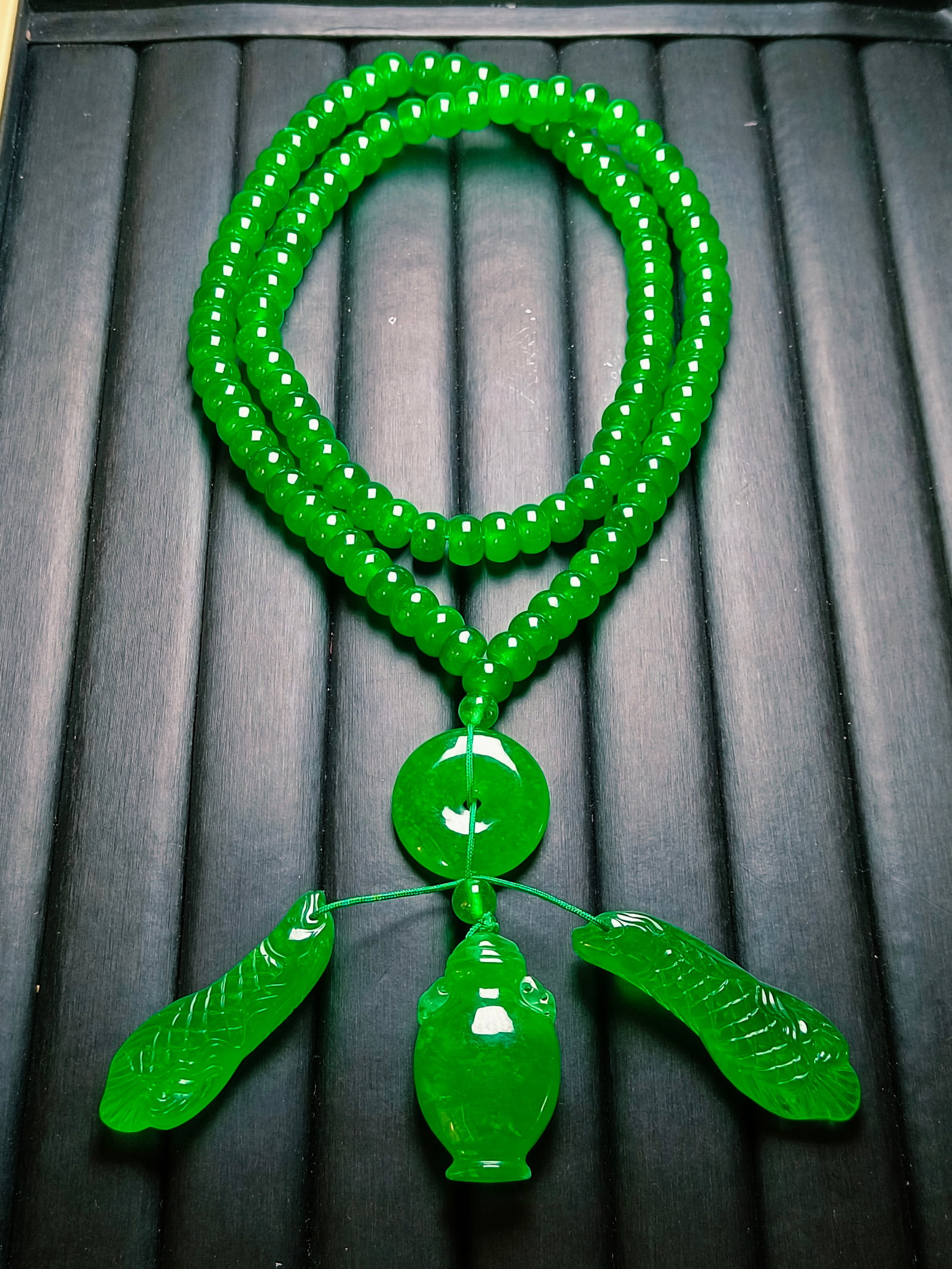 Dragon Stone Imperial Green Jadeite Abacus Bead Pendant Necklace: Dragon Stone Imperial Green Jadeite Abacus Bead Pendant Necklace Provenance:Mr. Jacob, Maryland. Inherited from his father. Our dedicated team expertly handles both domestic and global shipping arrang