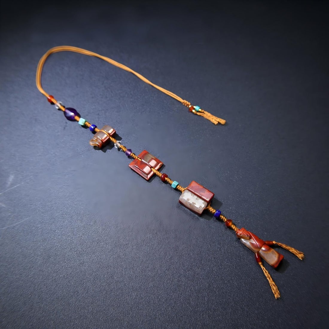 A rare and exquisite set of Warring States period red compass pendant coins with the character "??" (1 of 9)