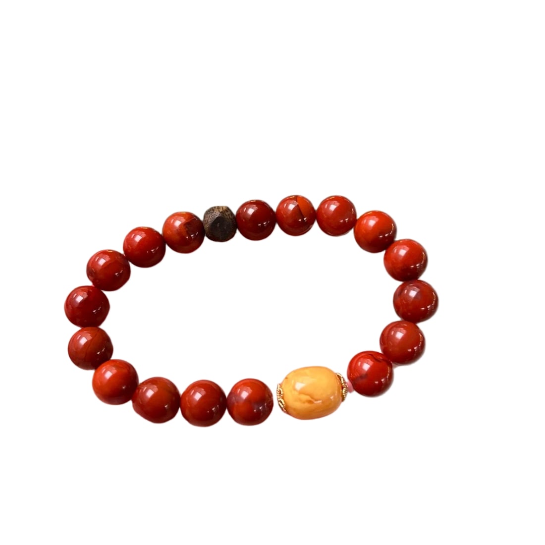 Natural Wasi material oxblood red flame pattern single-strand bracelet: Natural Wasi jade oxblood red flame pattern single-strand bracelet paired with agarwood and amber. Fine texture and excellent jade quality. Size: 9mm. Total weight: 22.5g. Provenance:Private collectio