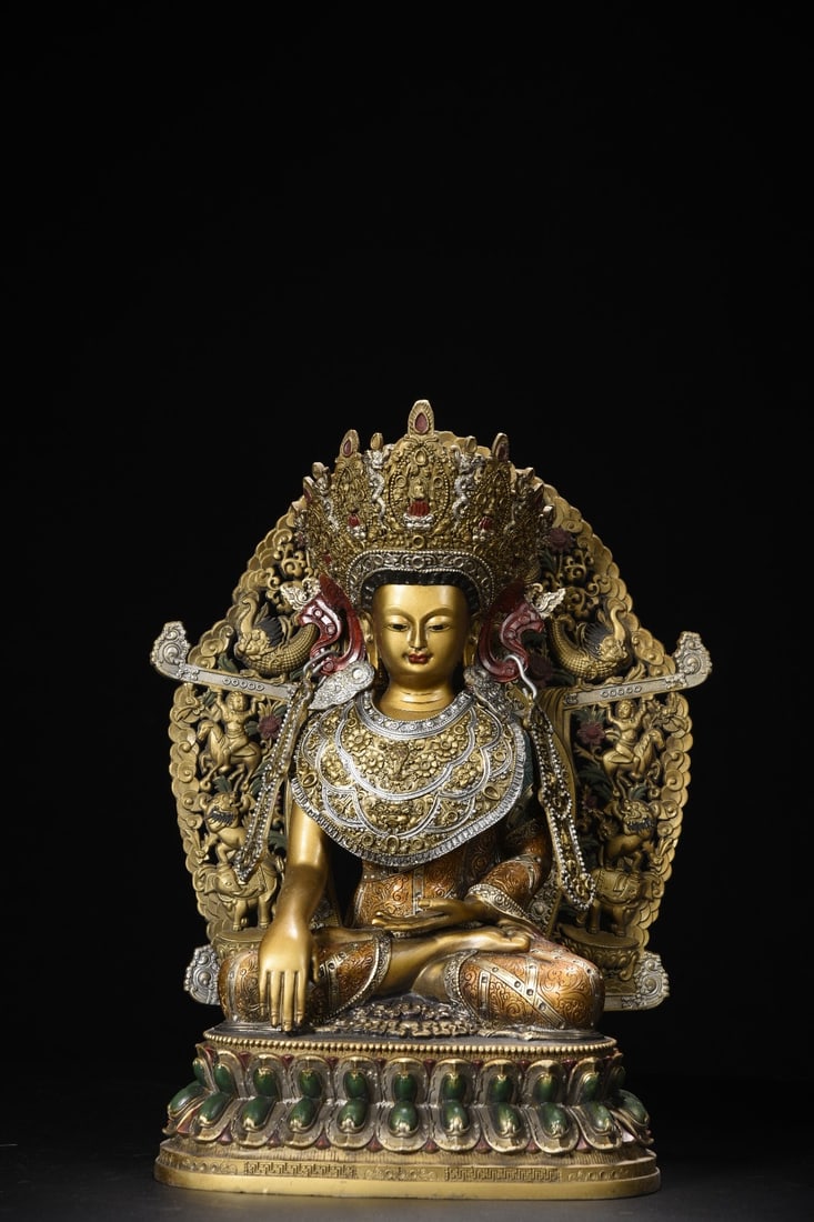 Copper Painted Vairocana Buddha Statue: A bronze painted statue of Vairocana Buddha, 33cm high, 26cm wide, 16cm thick, and weighing 3385 grams. Provenance:Private Estate, Michigan. Our dedicated team expertly handles both domestic and globa