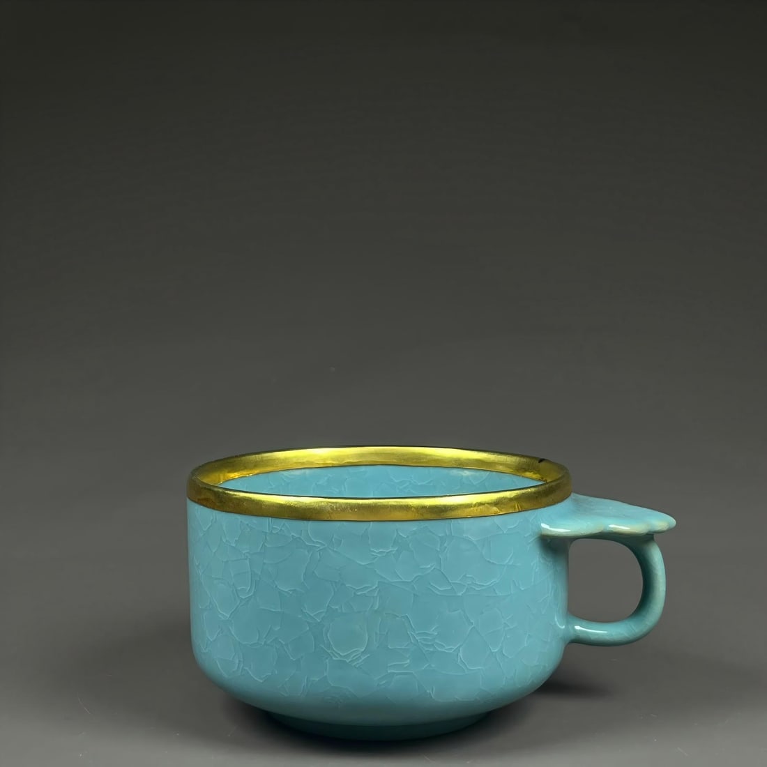 Formerly in the collection of a Song Dynasty Ru ware celadon-glazed cup with ice-crack pattern and (1 of 9)