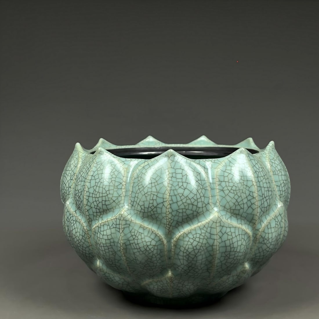 Formerly in the collection of a Song Dynasty Ru ware celadon lotus vase with silver clasp: Formerly in the collection, a Song Dynasty Ru ware celadon lotus-shaped vase with a silver clasp, 12x16cm. Provenance:Private collection, Quincy, Massachusetts. Our dedicated team expertly handles bot
