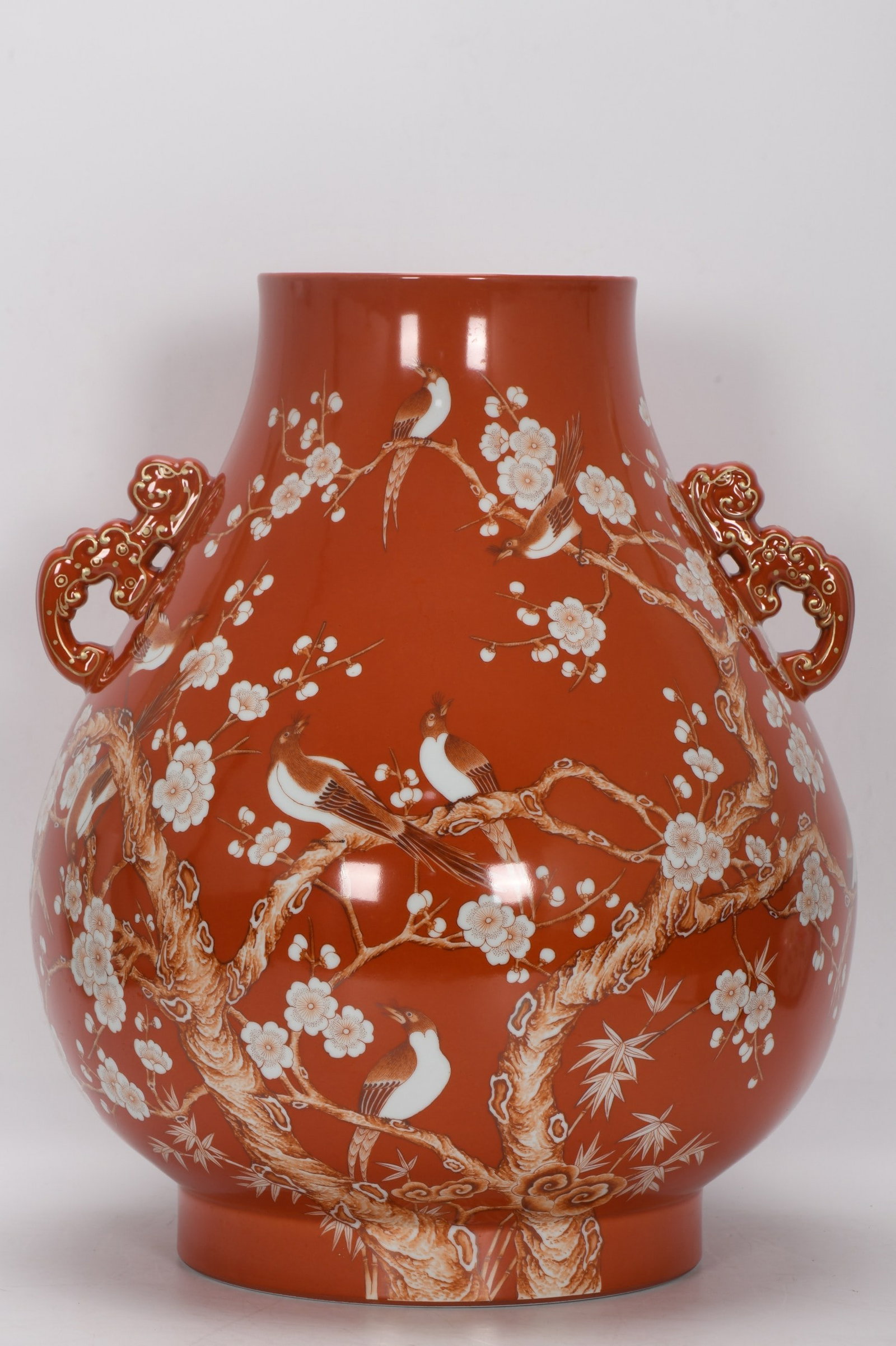 A Qing Dynasty Qianlong period famille rose enamel vase with coral red and white background, (1 of 9)