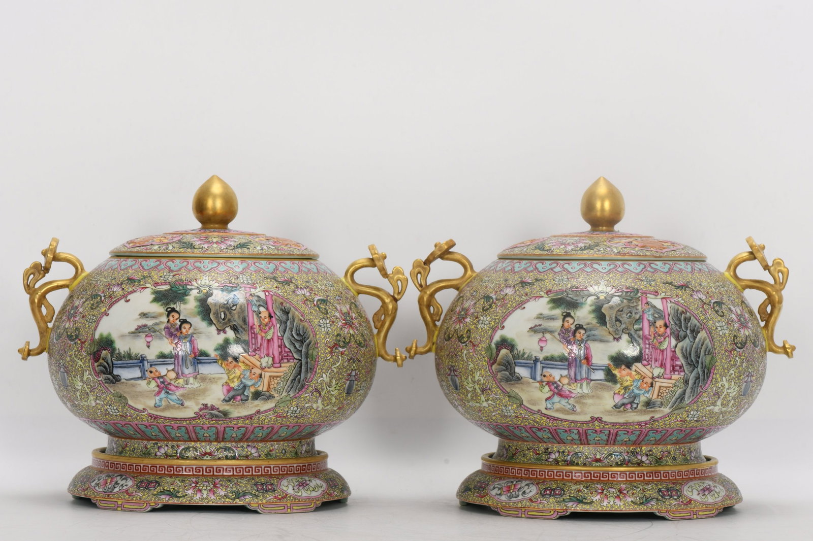 Qing Dynasty, Qianlong Period: Enamelled Guyuexuan Three-Tiered Jar with Windowed Figures and: A Qing Dynasty Qianlong period enamel-painted three-tiered jar with a window depicting figures and stories, featuring double handles and a ruyi-shaped base. It is 24.6 cm high, with an inner mouth dia