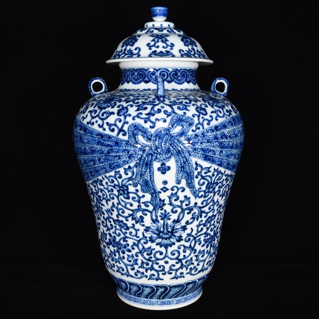 A four-eared blue and white porcelain jar with scrolling floral design from the Yongzheng period of (1 of 9)