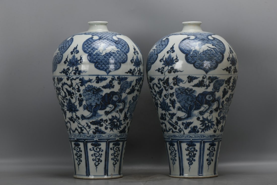 A pair of Yuan Dynasty blue and white porcelain plum vases with lotus scrolls, lions, and (1 of 9)