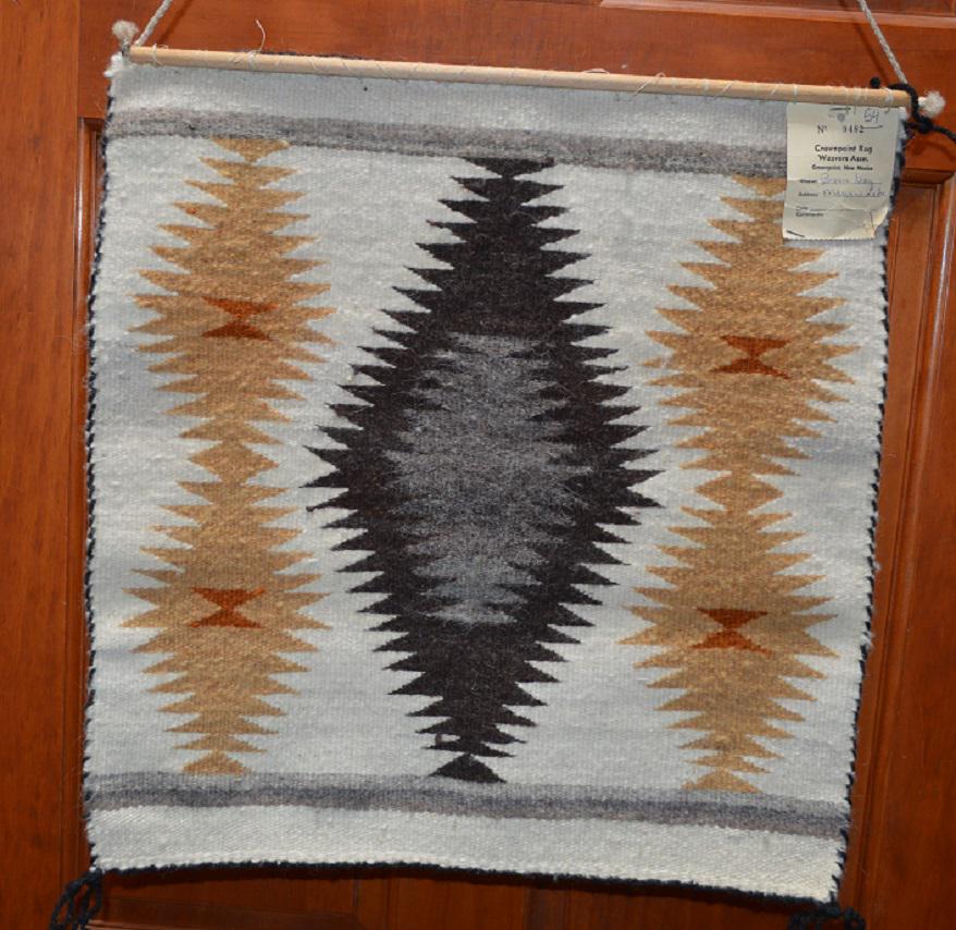 Navajo Woven Rug/Weaving Hanging Bessie Gray Vintage: Consigner told me an older Wool Woven Rug/Hanging, still has an older Crownpoint Rug Auction Tag on, shows Bessie Gray was the weaver. Bessie Gray- 1917-2009, was a Navajo Weaver. This approximately 1