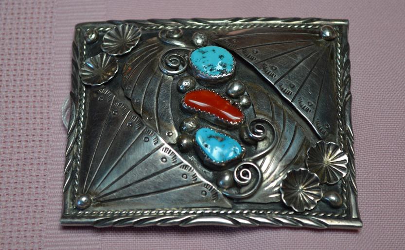 Signed Navajo Silver Belt Buckle, 3" by 2 1/2",: Very nice and fine silversmith craftsmanship to this Silver Belt Buckle. Measures about 3" by 2 1/2", has both Turquoise and Coral stones, intricate details, signed but can not make out the Silversmit