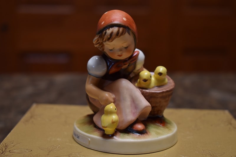 Hummel "Chick Girl" Figurine West Germany: Measuring 3 1/4" tall, and 3" side at base, "Chick Girl" has a young girl tending to her 3 chicks. No issues.