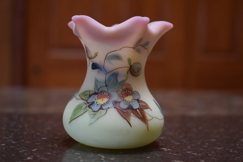 Victorian Thomas Webb Burmese Toothpick Holder 1800s: Nice Signed on base Thos Webb, late 1800's circa, peachblow satin Burmese toothpick holder with hand painted floral design, measures about 3" high and wide at fluted/crimped top edges. Wonderful grada