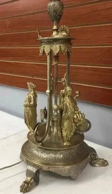 Antique large Bronze Lamp marked with Makers Stamp: Antique large Bronze Lamp marked with Makers Stamp , please see pictures . Measures 24"tall x 14" wide . Very heavy . We not sure it was a lamp originally , recently electrified .