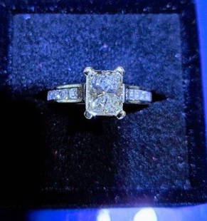 Platinum 1.57 Diamond VVS2 Wedding Ring Rectangular cut: RECTANGULAR CORNER CUT NATURAL DIAMOND, Center stone Weight-1.57 ct.Clarity VVS2,Color-I,PLATINUM ring with stamp containing center inprong setting. The ring also contains 12 princess cut diamonds tha