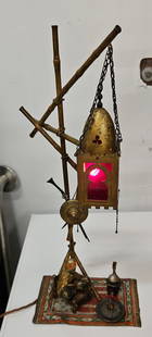 Franz Bergman Austrian Large Bronze Lamp Cold Painted: This cold painted bronze lamp from Franz Bergman depicts an Arab man seated in chair on carpet, drinking coffee. The lantern above features green and red glass. panels.. 18.25 x 8 x 5 in. 5 lbs.