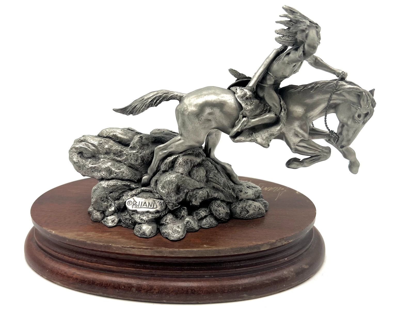Don Pollan sculpture "Crazy horse": Limited edition, numbered 717, signed and dated by the artist, '91. This sculpture is part of the Western Redemption Special. The sculpture and base together stand about 5" tall with an oval wooden ba