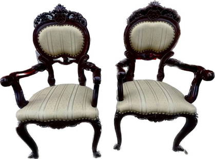 Pair of French Vietnamese rosewood arm chairs: Pair of early 20th century Louis XV-style French Vietnamese carved rosewood armchairs, the cartouche-shaped back sweeping to foliate carved arms, raised on cabriole legs, 40"h x 24"w x 18"d. IN VERY G
