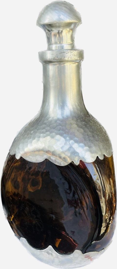 Royal Holland Hammered Pewter & Glass Decanter: Royal Holland Hammered Pewter & Glass Decanter. Vintage modern decanter, hammered pewter mounted over a three-sided rust glass bottle, marked to underside KDM Royal Holland Pewter Daalderop. Made in H