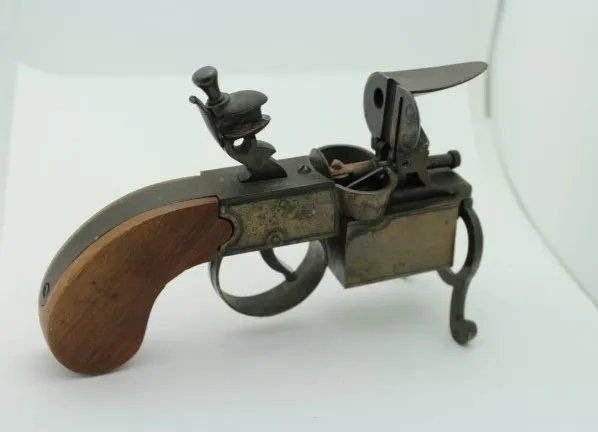 Dunhill Brass Tinder Pistol Lighter: Dunhill Tinder Pistol Figural Table Lighter. Stamped maker's mark. Length 6". Made In USA - Working.