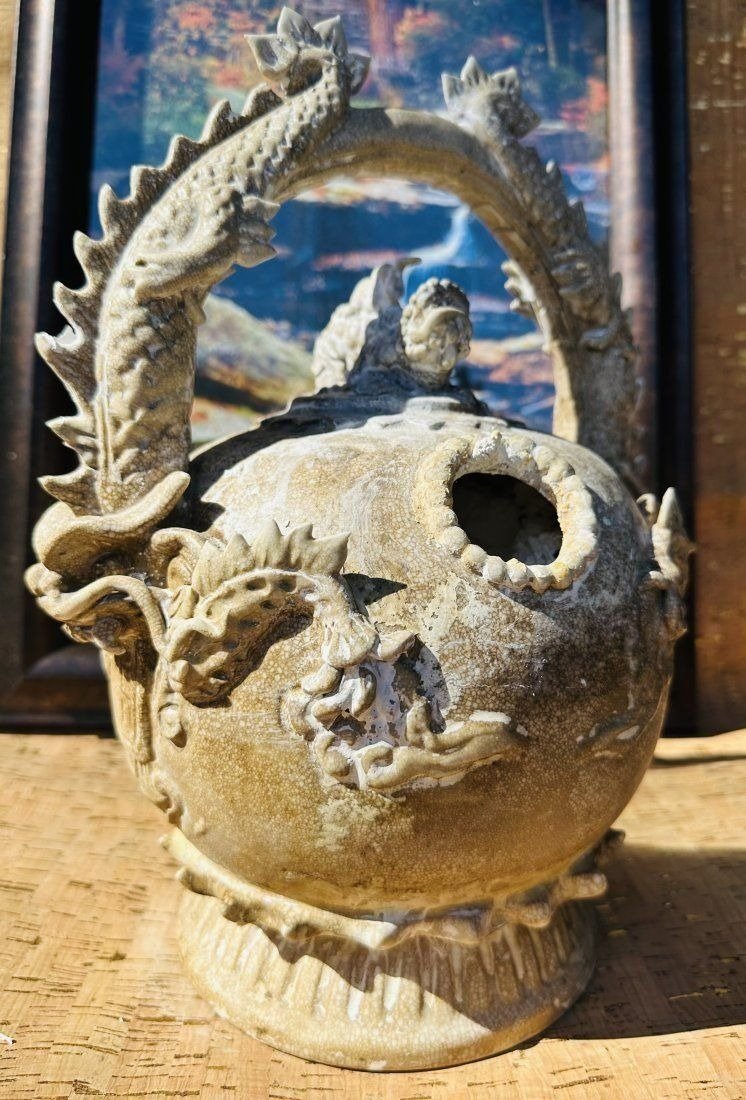 Antique Vietnamese Pottery Lime Pot Marked: Antique Vietnamese Pottery Lime Pot Marked. Southeast Asia, Vietnam. Unusual pottery bale handled pot used to hold lime powder. Lime was used as a means of enhancing the effects of opium. Dimensions: 