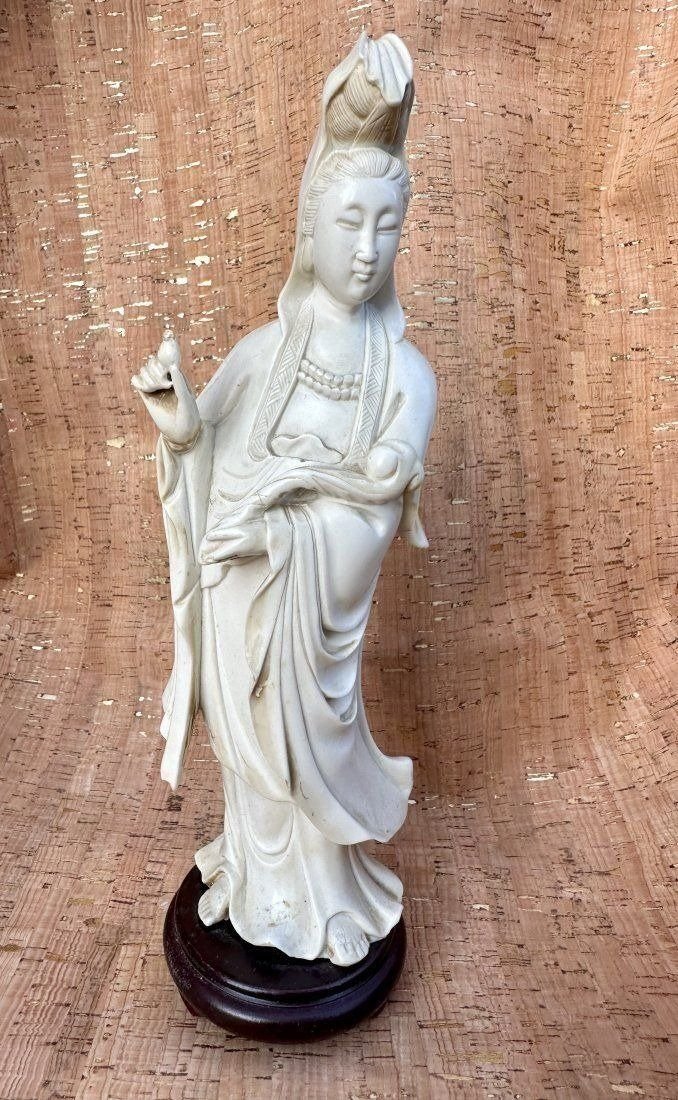 Antique Chinese Carved bone Figurine of Xu Yunlin Dehua Guanyin: Antique Chinese Carved bone Figurine of Xu Yunlin Dehua Guanyin . Presented on a Wooden Base. Overall measures 11H x 3.5W inches. In excellent condition