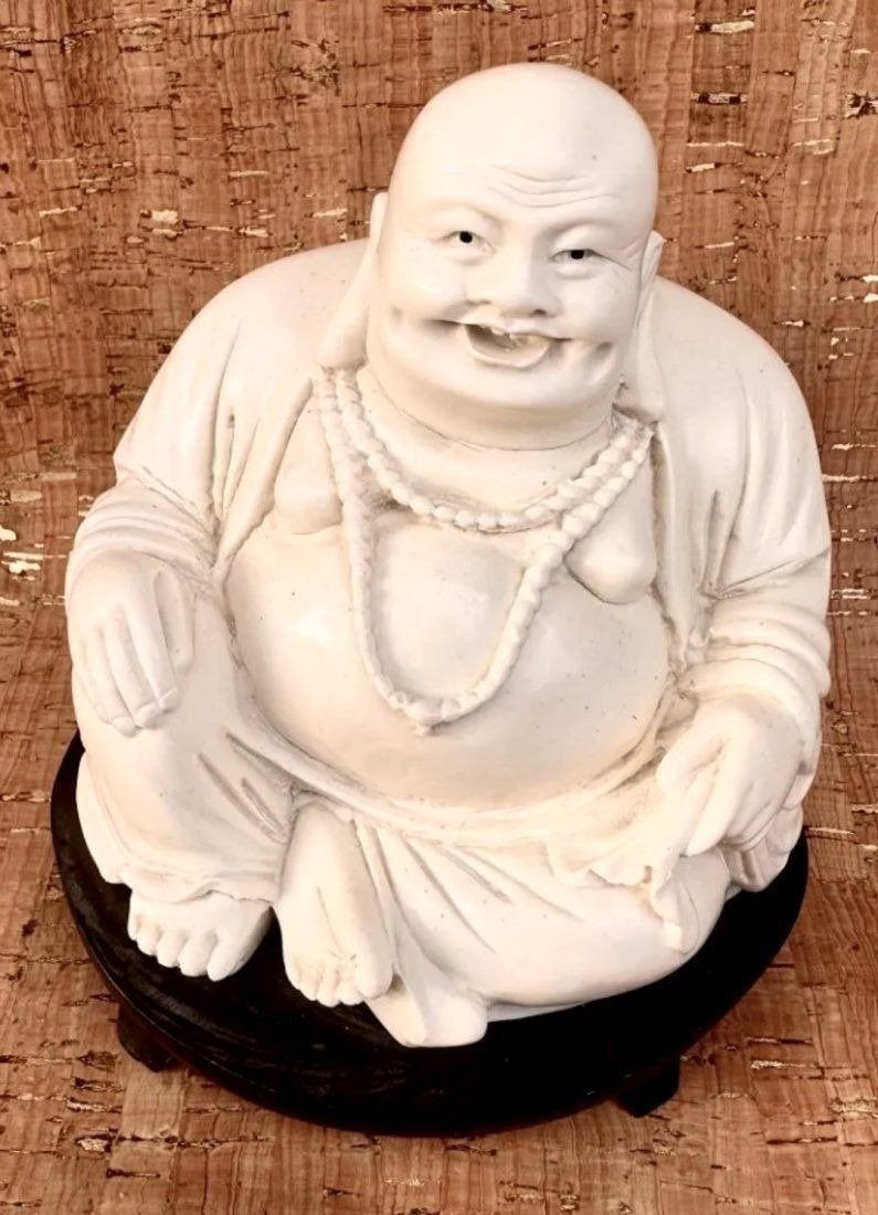 ANTIQUE CHINESE Hand carved bone LAUGHING BUDDHA STATUE figurine: ANTIQUE CHINESE LAUGHING BUDDHA STATUE. Hand-carved bone antique Chinese laughing Buddha. Presented on a Wooden Base. Overall measures 5.5H x 6W x 5D inches. In excellent condition
