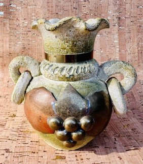 Antique vase with copper grape decoration