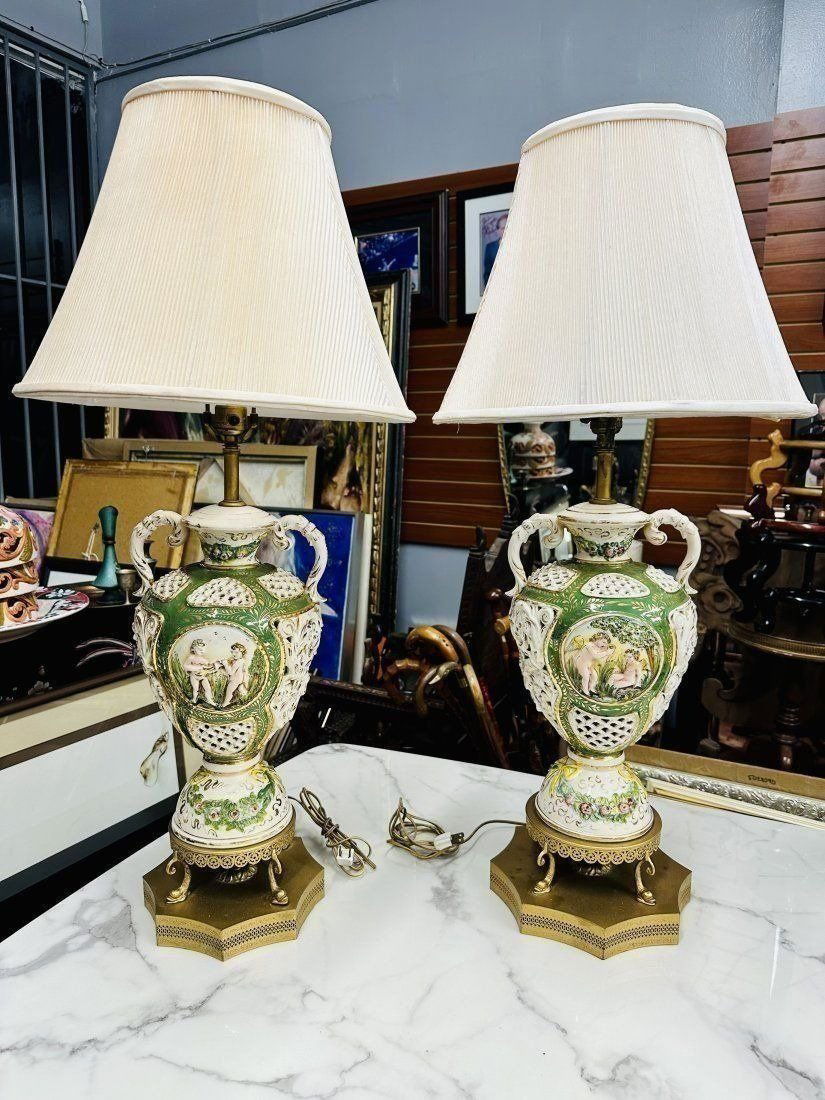 TWO LARGE ITALIAN CAPODIMONTE FIGURAL PORCELAIN LAMPS: TWO LARGE ITALIAN CAPODIMONTE FIGURAL PORCELAIN LAMPS. Lot of two large Italian porcelain table lamps. 35” H with shade. Excellent condition.