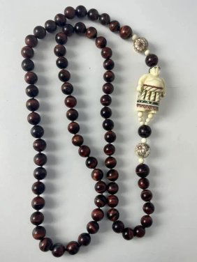Tiger Eye Beads with carved bone Buddha