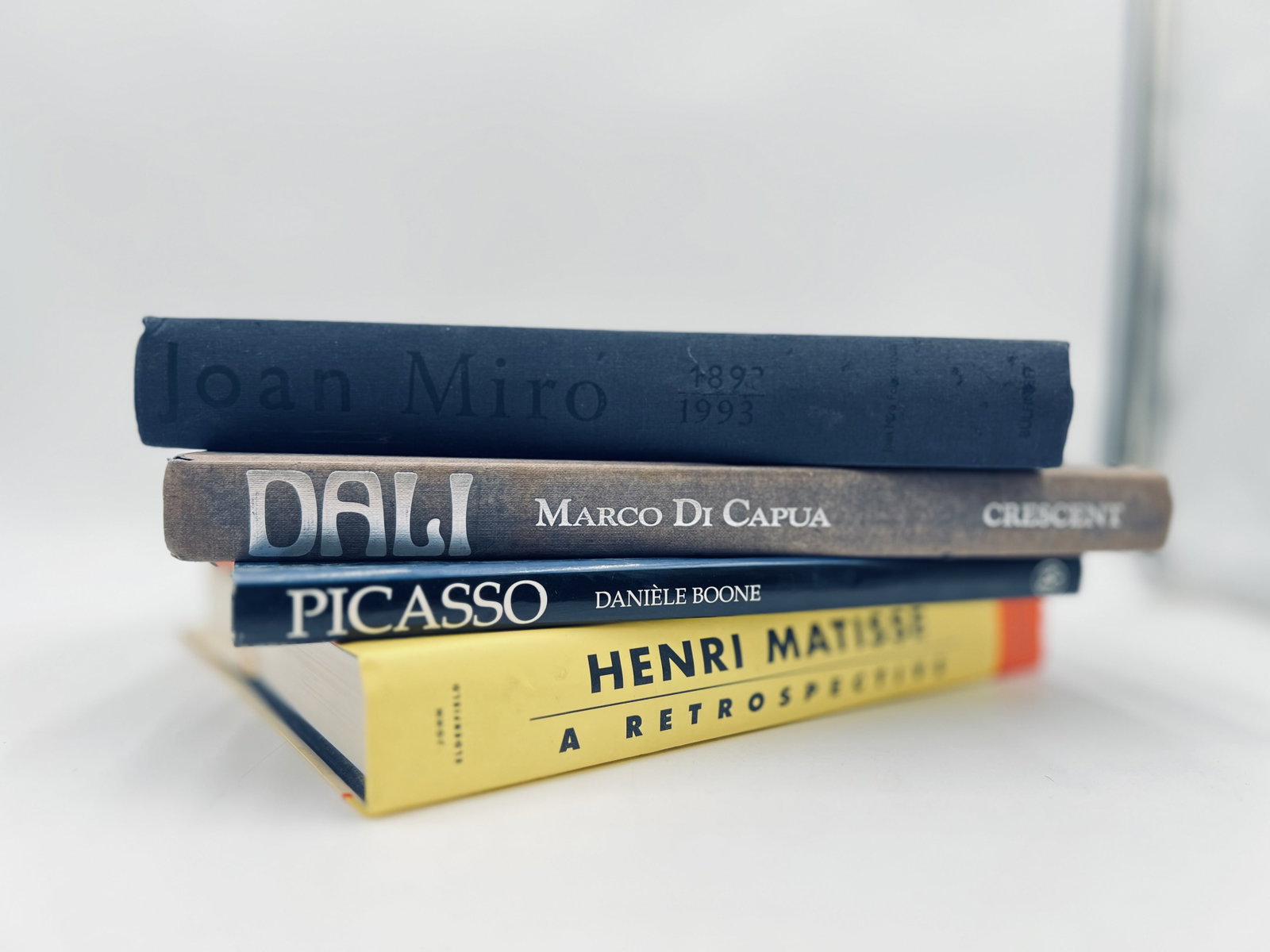 Collection of Books about Henry Matisse, Dali, Picasso and Miro,: Collection of Books about Henry Matisse, Dali, Picasso and Miro. Their life biography, and collection of works: "Henry Matisse- A retrospective" by John Elderfield(12"x10"), "Dali" by Marco Di Capua(1