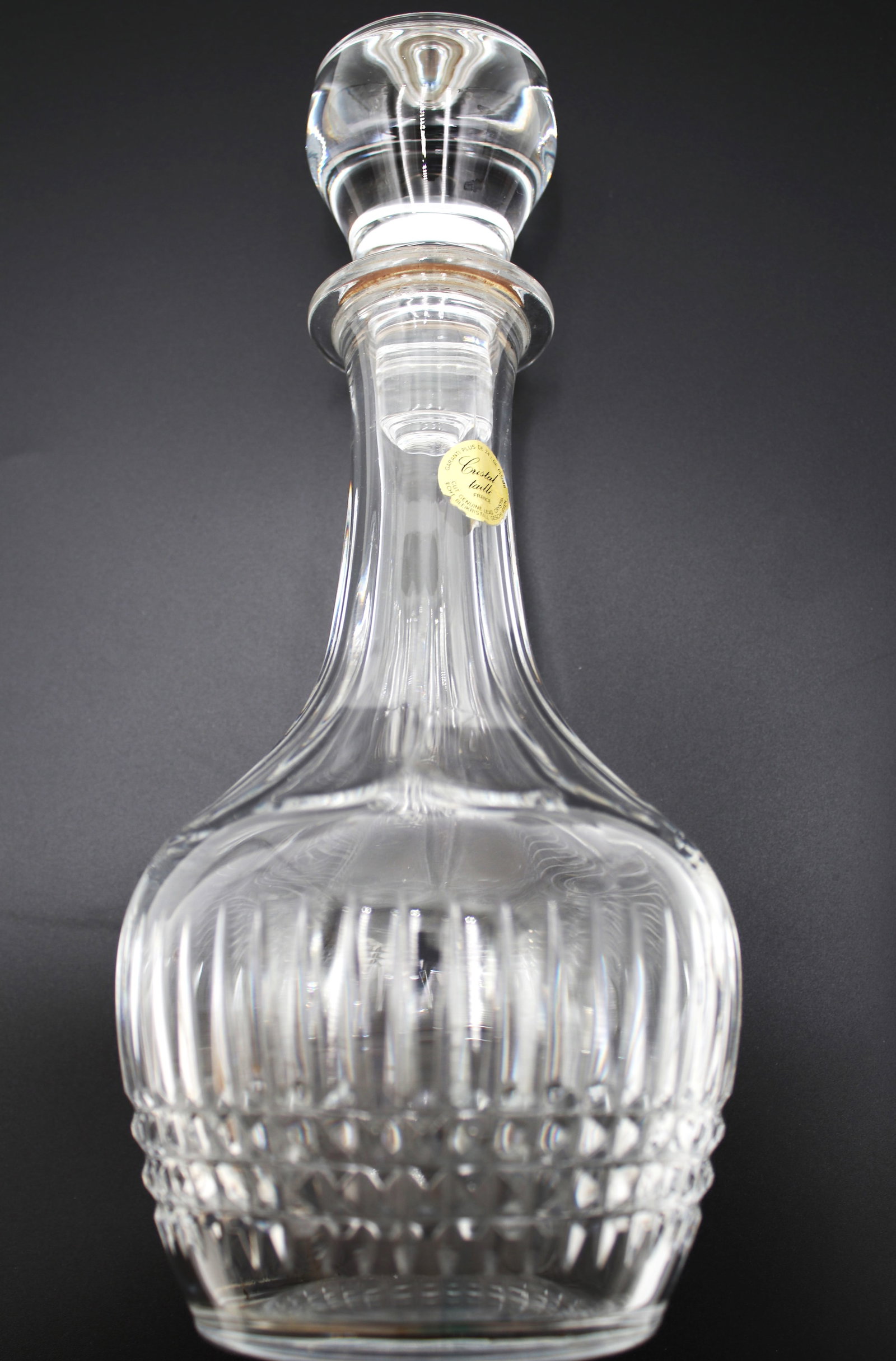 French Crystal taille, with a stopper.: French Crystal taille. Cut genuine lead crystal. More than 24% lead.Lead crystal is a kind of glass that contains lead oxide. The addition of lead oxide raises the glass's refractive index, a measurem