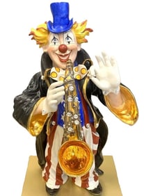 CERAMIC CLOWN FIGURINE WITH SAXOPHONE. CAPODIMONTE ITALY.