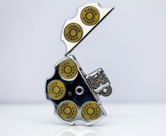 THE REVOLVER REFILLABLE OIL LIGHTER